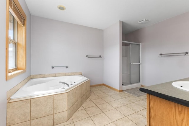 27401 Brandon Cir, Steamboat Springs, CO 80487 - bathroom with a shower stall, a garden tub, vanity, tile patterned floors, and baseboards