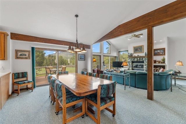 50 Lichen Ln, Keystone, CO 80435 - dining space featuring light colored carpet, vaulted ceiling, ceiling fan, and a fireplace