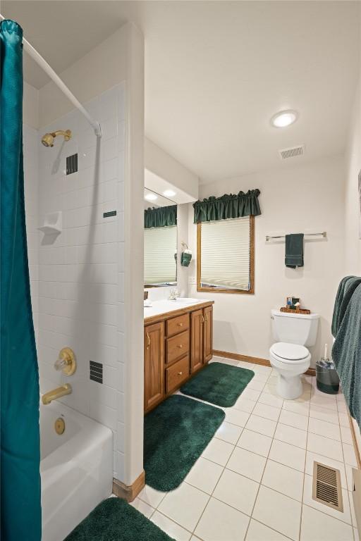 50 Lichen Ln, Keystone, CO 80435 - bathroom featuring tile patterned flooring, toilet, shower / bath combo with shower curtain, vanity, and baseboards