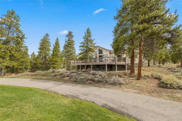 50 Lichen Ln, Keystone, CO 80435 - view of front of home featuring a wooden deck and a front lawn