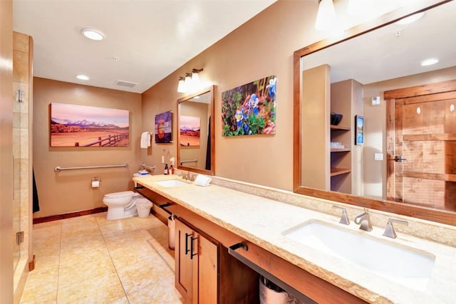full bathroom with visible vents, a sink, a shower with shower door, and toilet