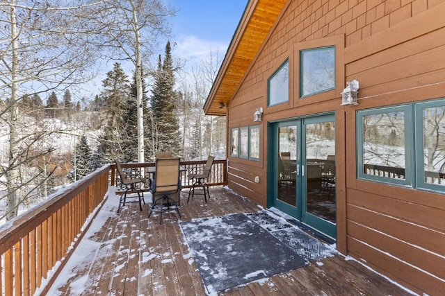 32596 Ute Trl, Oak Creek, CO 80467 - snow covered deck with outdoor dining space and french doors