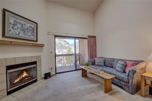 715 S 5th Ave Unit 260, Frisco, CO 80443 - living area with a fireplace, high vaulted ceiling, and light colored carpet
