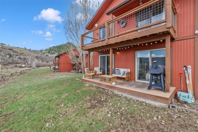 23800 County Road 16 Unit 204, Oak Creek, CO 80467 - rear view of property with a yard and a deck with mountain view