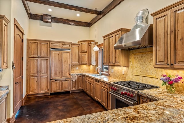 24100 Cottonwood Rd N, Clark, CO 80428 - kitchen featuring premium appliances, wall chimney range hood, light stone countertops, brown cabinets, and beamed ceiling