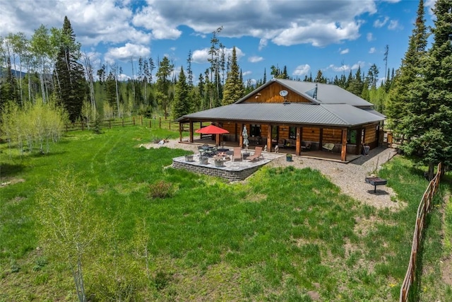 24100 Cottonwood Rd N, Clark, CO 80428 - back of property featuring a patio area and metal roof
