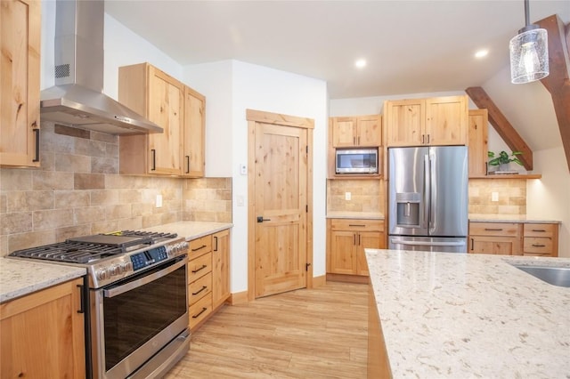 297 Robertson Ln, Breckenridge, CO 80424 - kitchen featuring stainless steel appliances, wall chimney exhaust hood, light brown cabinetry, light wood finished floors, and recessed lighting