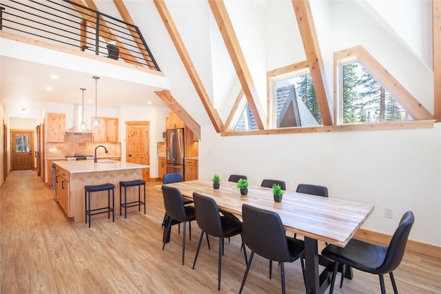 297 Robertson Ln, Breckenridge, CO 80424 - dining area featuring high vaulted ceiling, beam ceiling, light wood finished floors, and recessed lighting