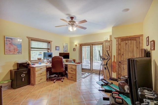 home office featuring a ceiling fan and light tile patterned floors