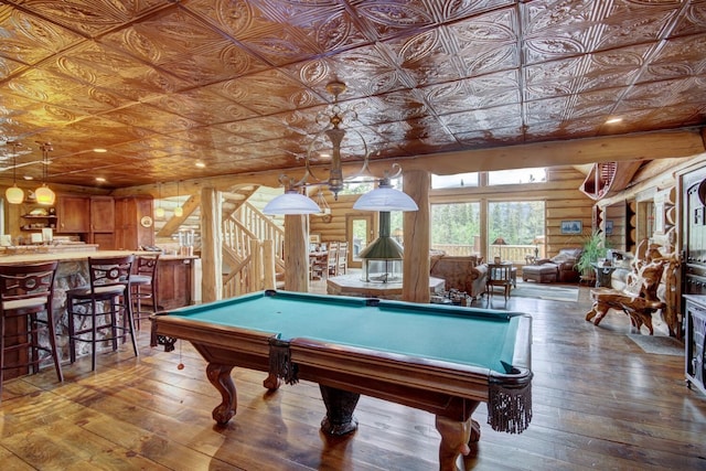 playroom featuring hardwood / wood-style flooring, log walls, and billiards