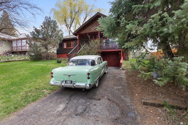 820 Yahmonite St, Steamboat Springs, CO 80487 - view of front of house with asphalt driveway and a front yard