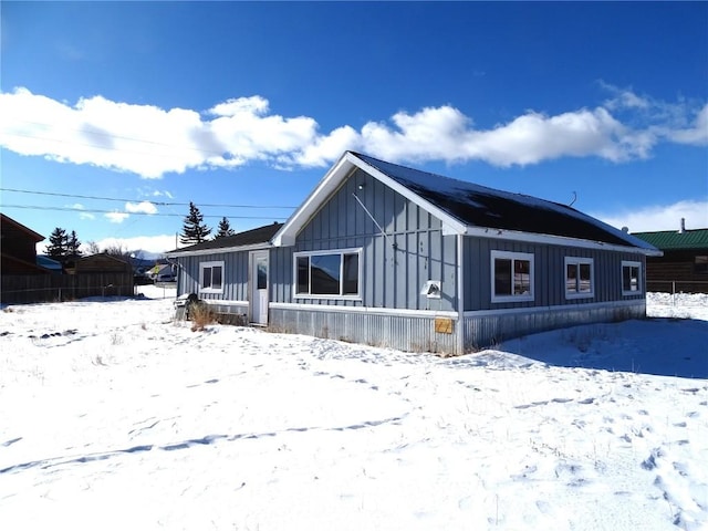 781 Hathaway St, Fairplay, CO 80440 - snow covered rear of property with board and batten siding