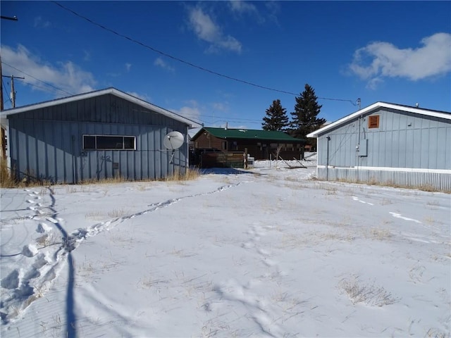 781 Hathaway St, Fairplay, CO 80440 - view of snowy exterior featuring board and batten siding