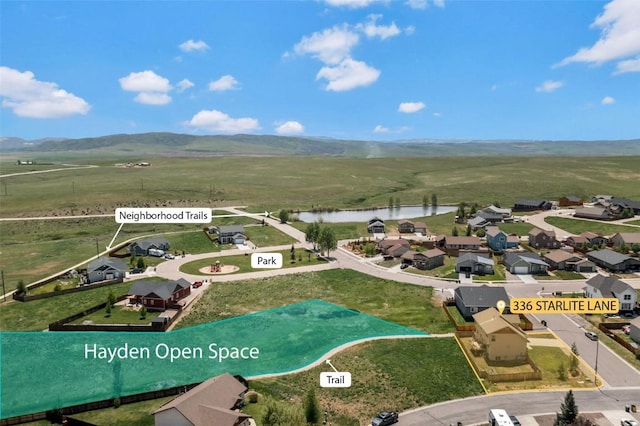 336 Starlite Ln, Hayden, CO 81639 - aerial perspective of suburban area with a water and mountain view and property parcel outlined