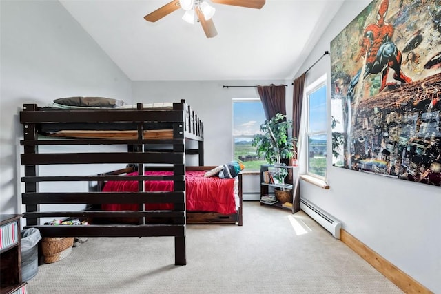 336 Starlite Ln, Hayden, CO 81639 - carpeted bedroom with a baseboard radiator, lofted ceiling, and a ceiling fan