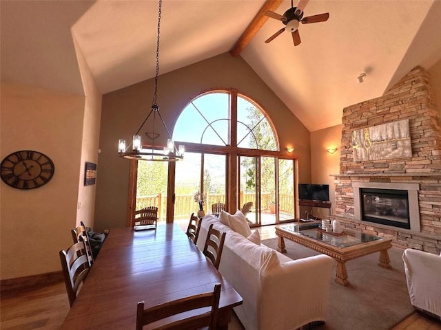 368 Black Hawk Cir, Silverthorne, CO 80498 - living area with ceiling fan, beamed ceiling, high vaulted ceiling, a fireplace, and wood finished floors