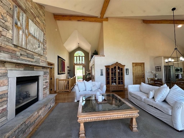 368 Black Hawk Cir, Silverthorne, CO 80498 - living area featuring a chandelier, high vaulted ceiling, beam ceiling, and a fireplace