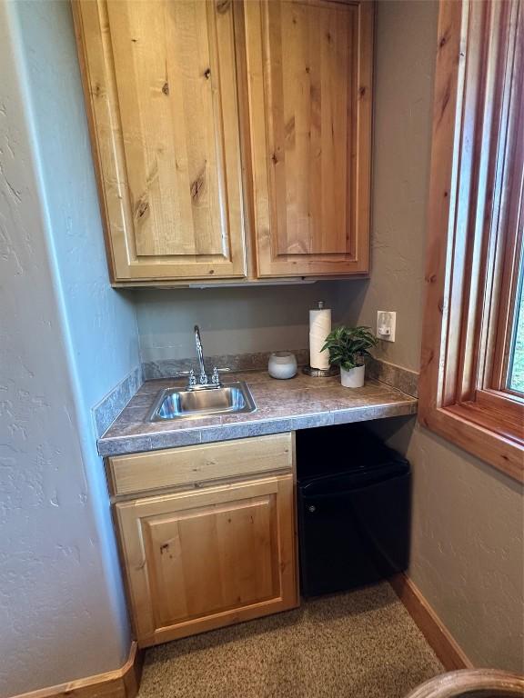 368 Black Hawk Cir, Silverthorne, CO 80498 - bar with a sink and baseboards