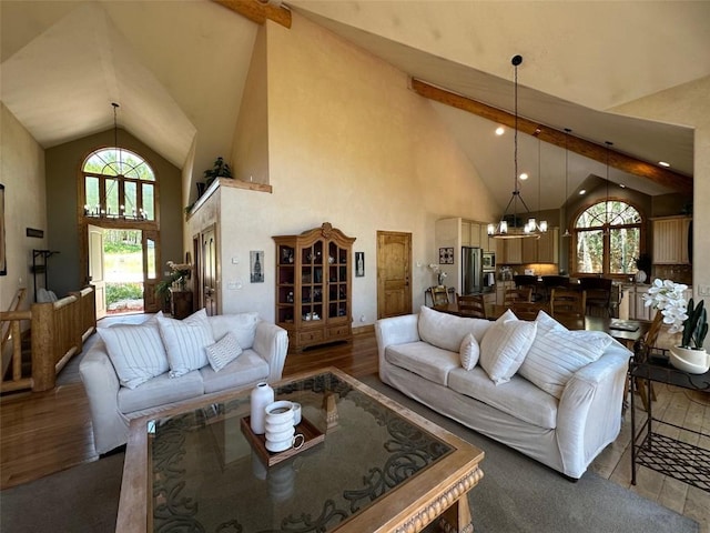 368 Black Hawk Cir, Silverthorne, CO 80498 - living area featuring a chandelier, high vaulted ceiling, and wood finished floors