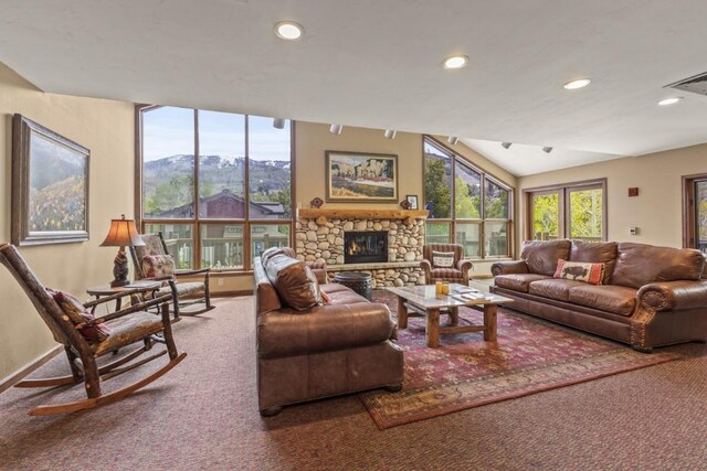 1720 Ranch Rd Unit 301, Steamboat Springs, CO 80487 - living area with carpet, a mountain view, recessed lighting, a fireplace, and lofted ceiling