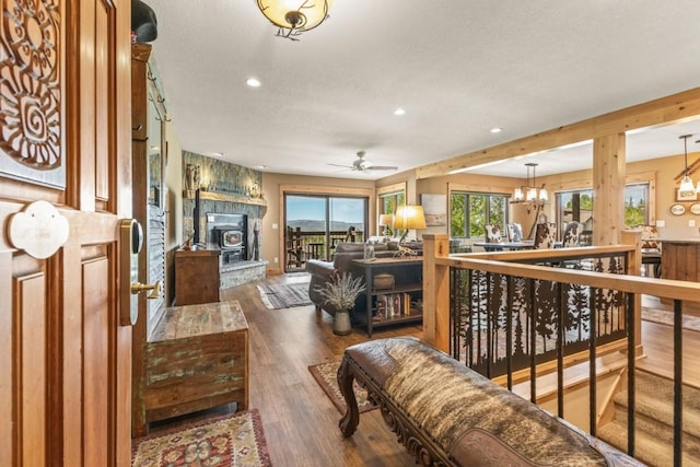 1720 Ranch Rd Unit 301, Steamboat Springs, CO 80487 - living area with recessed lighting, wood finished floors, ceiling fan, and a chandelier