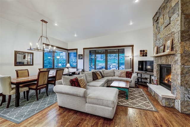 53 Hargrove Way, Silverthorne, CO 80498 - living room featuring wood finished floors, a fireplace, recessed lighting, and a chandelier