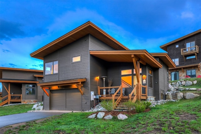 53 Hargrove Way, Silverthorne, CO 80498 - view of front facade featuring an attached garage, asphalt driveway, and a front yard