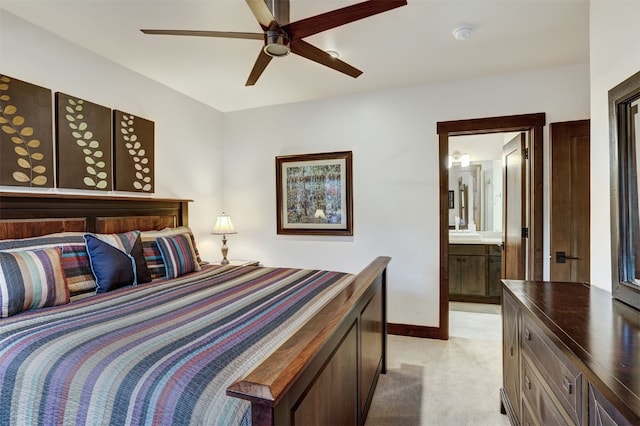 53 Hargrove Way, Silverthorne, CO 80498 - bedroom with light carpet, ensuite bathroom, baseboards, and ceiling fan
