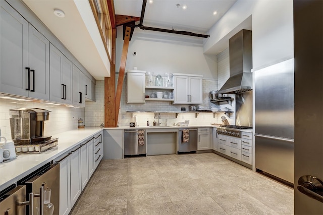 53 Hargrove Way, Silverthorne, CO 80498 - kitchen featuring wall chimney exhaust hood, stainless steel appliances, open shelves, backsplash, and a sink