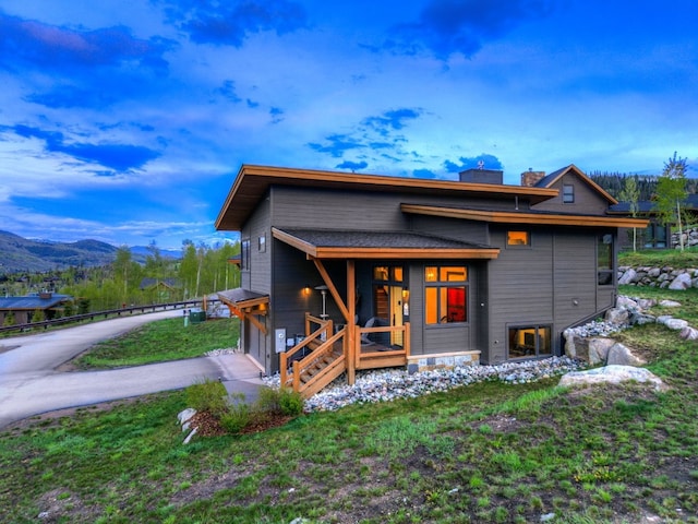 53 Hargrove Way, Silverthorne, CO 80498 - view of front of house featuring a garage, a mountain view, and driveway