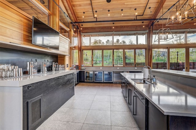 53 Hargrove Way, Silverthorne, CO 80498 - kitchen with wood ceiling, light countertops, a sink, dark cabinets, and light tile patterned flooring