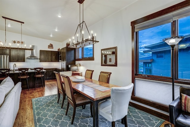 53 Hargrove Way, Silverthorne, CO 80498 - dining area with a chandelier, wood finished floors, vaulted ceiling, and recessed lighting
