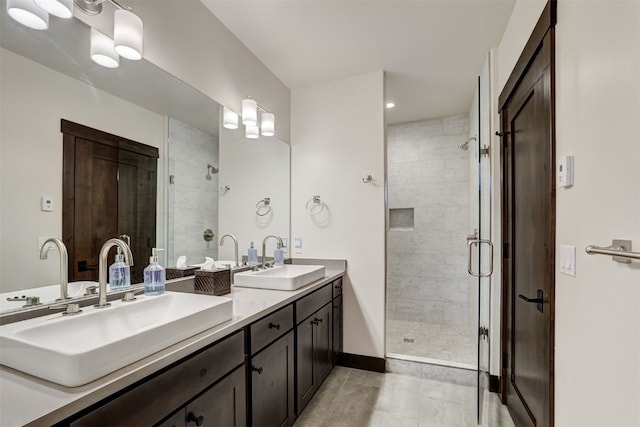 53 Hargrove Way, Silverthorne, CO 80498 - full bathroom featuring a shower stall, double vanity, tile patterned floors, and baseboards