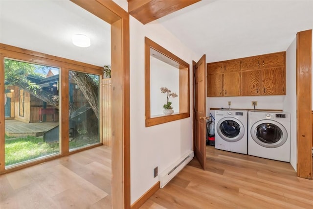 211 W Oak St, Oak Creek, CO 80467 - laundry room with a baseboard heating unit, cabinet space, washer and dryer, and light wood-style flooring