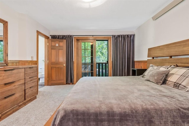 211 W Oak St, Oak Creek, CO 80467 - bedroom featuring carpet, access to exterior, wainscoting, and wood walls