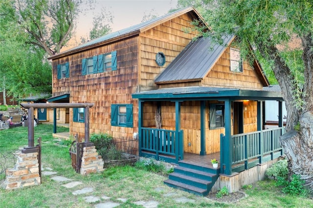 211 W Oak St, Oak Creek, CO 80467 - view of front of property with a metal roof, covered porch, and a front yard