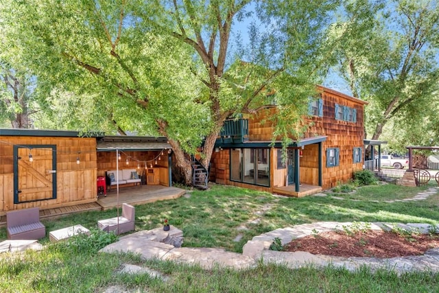 211 W Oak St, Oak Creek, CO 80467 - rear view of property with a yard and an outbuilding