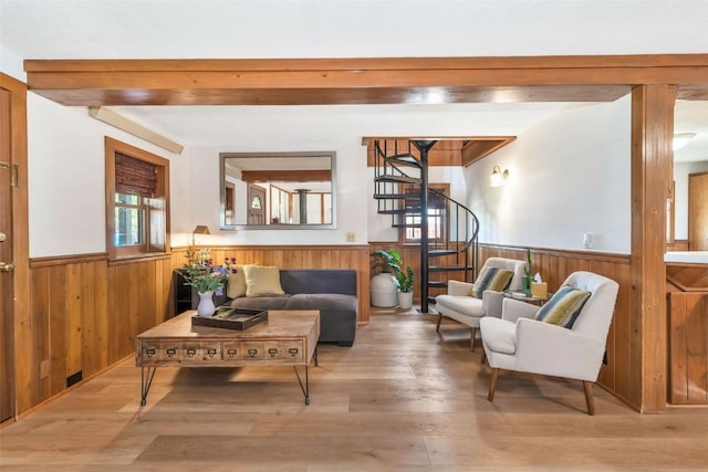 211 W Oak St, Oak Creek, CO 80467 - living area with wainscoting, stairs, wood finished floors, and wood walls