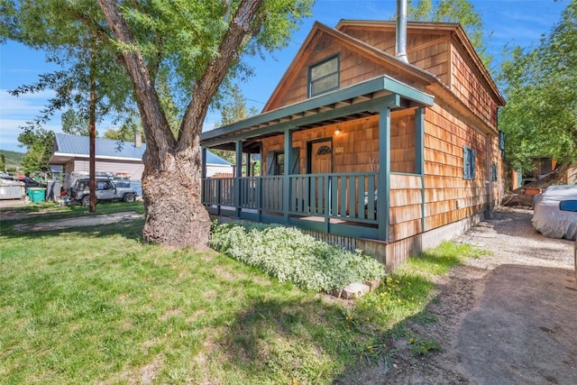 211 W Oak St, Oak Creek, CO 80467 - view of front facade with a porch and a front lawn