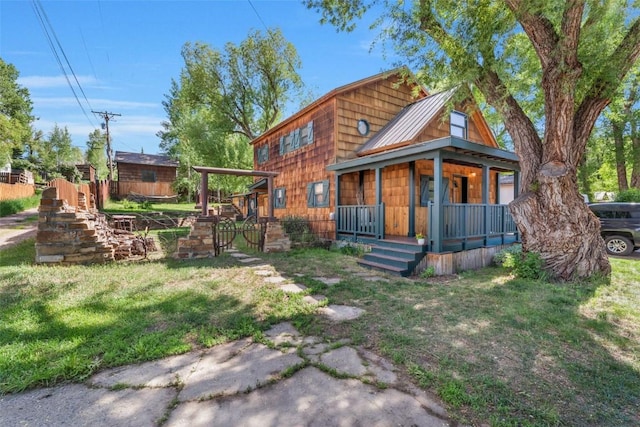 211 W Oak St, Oak Creek, CO 80467 - view of front facade featuring covered porch, a metal roof, and a standing seam roof