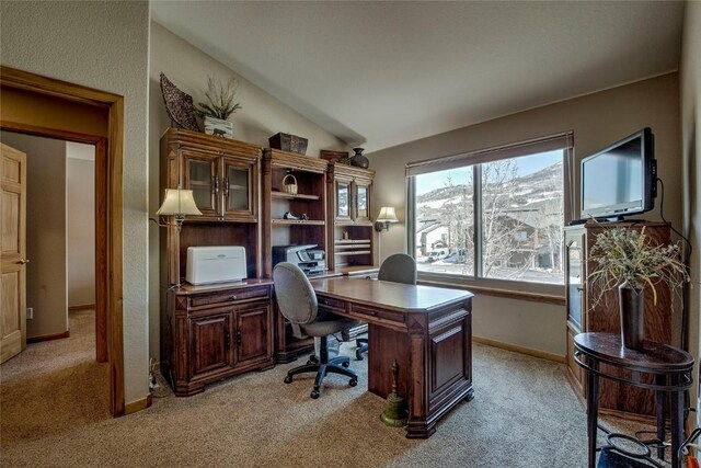 131 Allegra Ln Unit 131, Silverthorne, CO 80498 - home office featuring light carpet, lofted ceiling, and baseboards