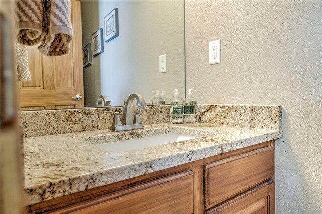 131 Allegra Ln Unit 131, Silverthorne, CO 80498 - bathroom featuring a textured wall and vanity