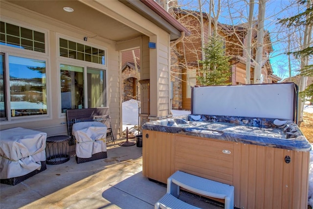 131 Allegra Ln Unit 131, Silverthorne, CO 80498 - view of patio / terrace with a hot tub