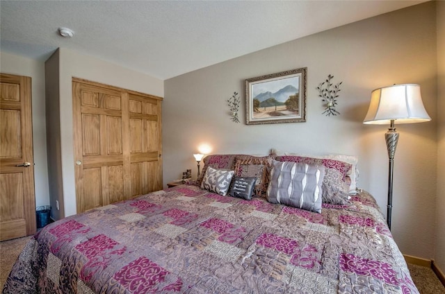 131 Allegra Ln Unit 131, Silverthorne, CO 80498 - bedroom featuring carpet floors, a closet, and baseboards