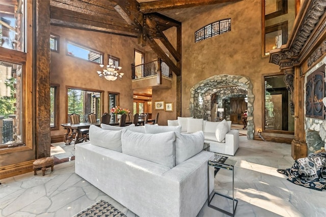 165 River Park Dr, Breckenridge, CO 80424 - living area with a high ceiling, beam ceiling, and a chandelier