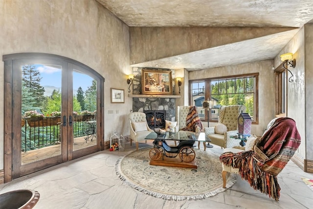 165 River Park Dr, Breckenridge, CO 80424 - living area with healthy amount of natural light, french doors, stone finish floors, a high ceiling, and arched walkways