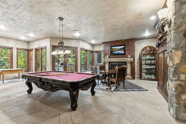 165 River Park Dr, Breckenridge, CO 80424 - playroom featuring stone floors, a warm lit fireplace, and pool table