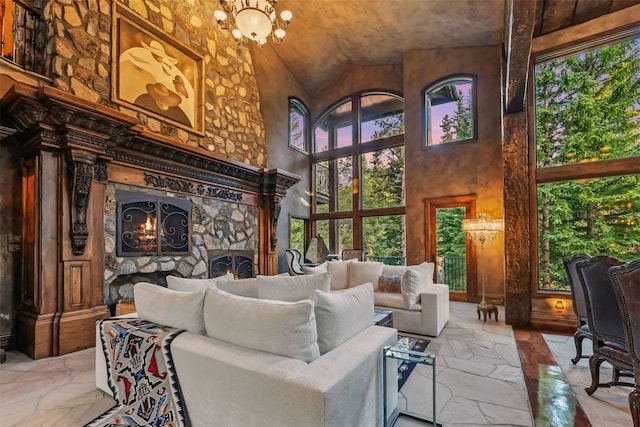 165 River Park Dr, Breckenridge, CO 80424 - living area featuring a towering ceiling, healthy amount of natural light, a chandelier, stone flooring, and a fireplace