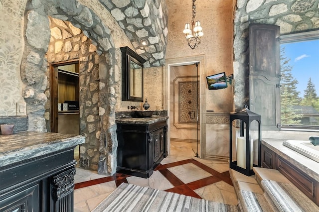 165 River Park Dr, Breckenridge, CO 80424 - full bath with vanity, a chandelier, and inlaid floor details