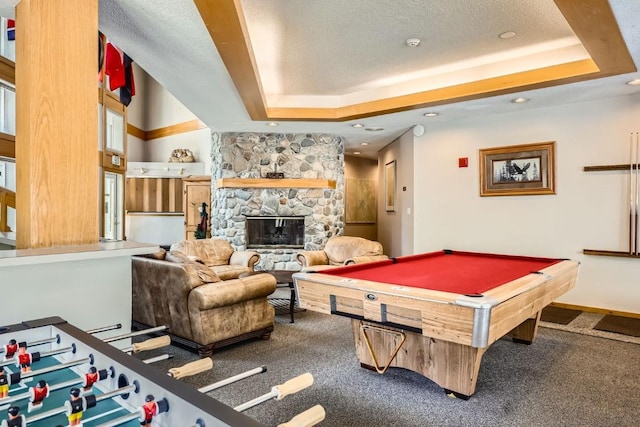 231 Creekside Dr Unit 102, Frisco, CO 80443 - recreation room with carpet flooring, a tray ceiling, a stone fireplace, a textured ceiling, and billiards